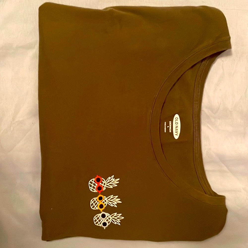 I am selling a brown t-shirt that has pineapples on it and its from old navy
